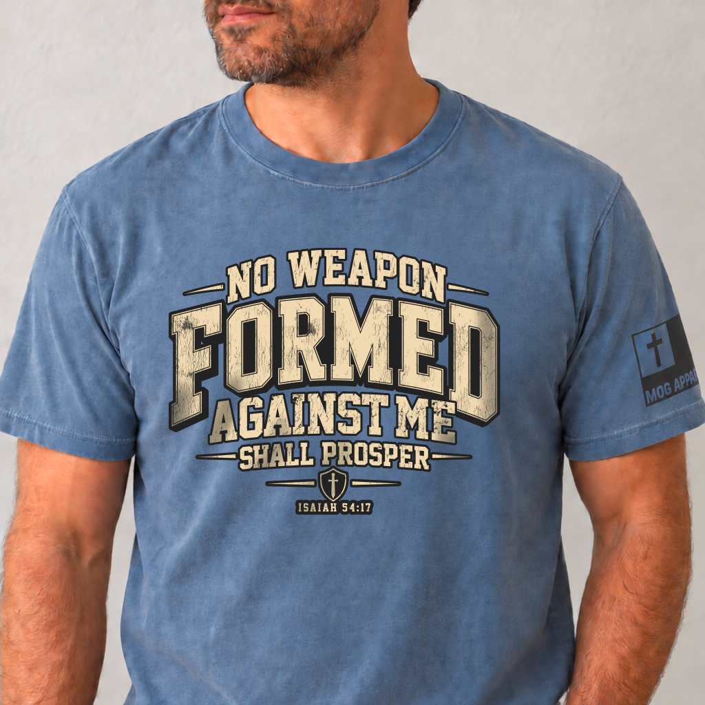 Blue Jean Comfor Colors Tee with No Weapon Formed Against Me Shall Prosper printed on the front and the MOG Apparel Flag Logo on the left sleeve.